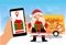 Woman hand holding mobile phone and  Tracking  online, Delivery santa claus with gift box standing at customer house. Contactless