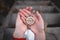 Woman hand holding a old compass with broken glass and ladybug. Travel concept, path selection, navigation, tourism, hiking.