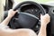 Woman Hand Holding Steering Wheel