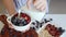 Woman Hand Holding Vegetarian Breakfast Bowl, Pouring Milk, Fresh Food Concept