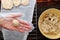 Woman hand make cassava pies on furnace bar to bake pastry