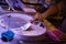 Woman hand making ice cream on round cold plate