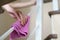 Woman hand with micro fiber cloth and detergent spray cleaning stairs at home