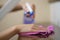 Woman hand with micro fiber cloth and detergent spray cleaning stairs at home