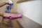 Woman hand with micro fiber cloth and detergent spray cleaning stairs at home