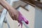 Woman hand with micro fiber cloth and detergent spray cleaning stairs at home