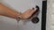 Woman hand opening and close white wooden door in office. Holding door handle. Full HD video motion