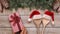 Woman hand placing christmas gift on table - top view