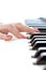 Woman hand play piano keyboard