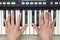 Woman hand playing a MIDI controller keyboard synthesizer close up