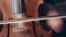 Woman hand playing violoncello with cello bow. Cello playing music background