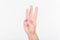 Woman Hand With Polish Nails Show Three Fingers. White Bakcground.