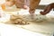 Woman hand potter making clay monstera leaf in pottery workshop studio. Process of creating ceramic vase. Handmade