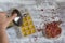 Woman hand pouring beverage made from brew dry rose petals for ice cube skin on the white background