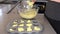 Woman hand preparing muffins in home kitchen