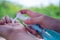 A woman hand presses a gel to wash hands to kill viruses or bacteria or germs. Prevention of covid-19 virus spread by hand