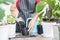 Woman hand putting soil in a pot preparing to plant , female planting plants, flower indoors , hobby and leisure concept