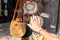 Woman hand on a rattan handbags background. Bali island.