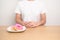 woman hand reject donut dessert, female refuse Unhealthy junk food. Dieting control, Weight loss, Obesity, eating lifestyle and