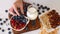 Woman Hand Serving Healthy Vegetarian Breakfast Blueberries, Strawberries Bowl