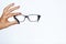 Woman hand showing Eye glasses stock photo