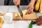 Woman Hand Slicing Banana, Preparation making Banana Sweet Potato Compote