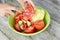 Woman hand slicing tomatoes for a healthy salad