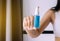 Woman hand spraying sanitizer gel bottle for hands hygiene coronavirus protection at home