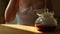 Woman hand takes coffee mug from table. Coffee shop client makes a sip of freshly brewed drip coffee in glass. Female