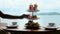Woman hand takes piece of cake from afternoon tea set for two persons in hotel