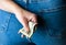 Woman hand taking money from jeans back pocket. Woman hiding money behind her back. Dollar banknotes close up