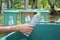 Woman hand throwing bottle water into trash can