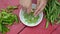 Woman hand unhusk pease dish wood table. ecologic food nutrition