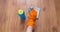 A woman hand Using blue rags wipe the wooden floor