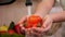 Woman hand washing cherry tomatos - closeup