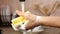 Woman hand washing the sponge at the kitchen tap while dishwashing