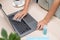 woman hand is wiped clean laptop with a cloth and alcohol