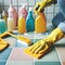 woman hand in yellow glove is cleaning tiled white surface in bathroom