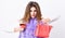 Woman with handbag hold glass of wine. Girl wear fashion fur vest while posing with bag. Luxury store concept. Elite