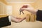 Woman Handing Over the House Keys Inside Empty Room