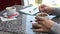 Woman hands adding sugar into coffee in cafe