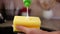 Woman hands apply washing up liquid on sponge from recipient