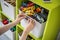 Woman hands applying sticker with name title of children toys for comfortable sorting and storage