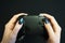 Woman hands with balck gamepad