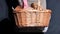 Woman hands with a basket full of fresh baked bread