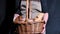 Woman hands with a basket full of fresh baked bread