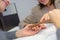 Woman hands with beautiful fingernails and nail file