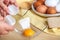 Woman hands breaking an egg to separate egg white and yolks, egg