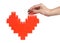 Woman hands building red heart