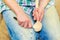 Woman hands carve wooden spoon